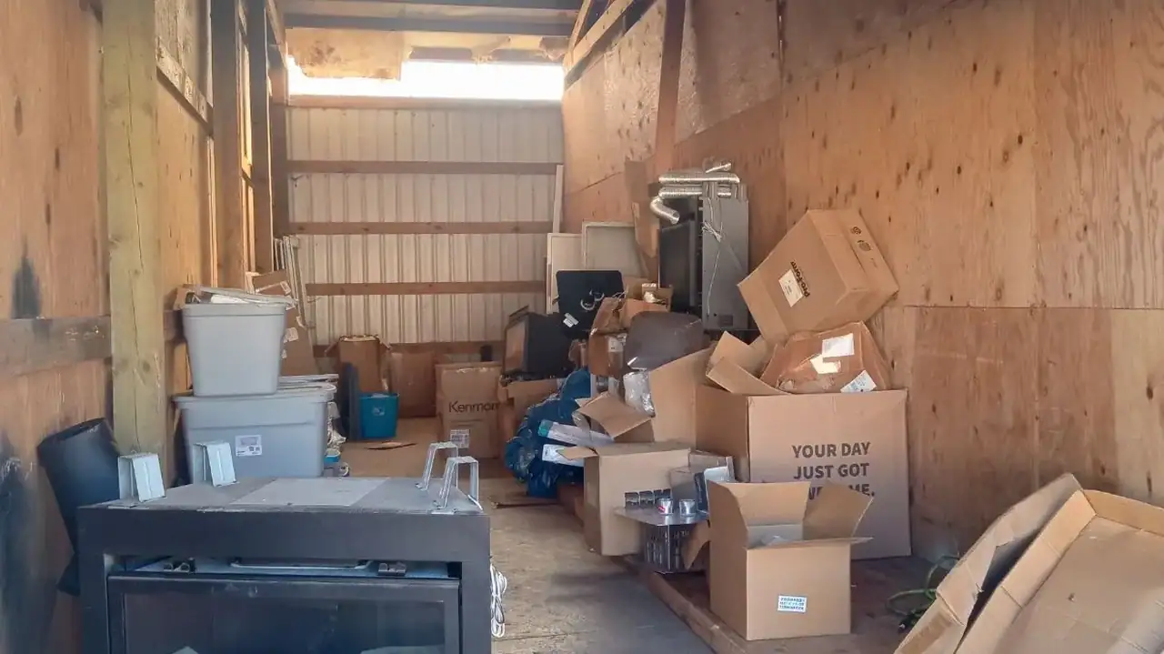 Before cleanout of a storage unit packed with boxes